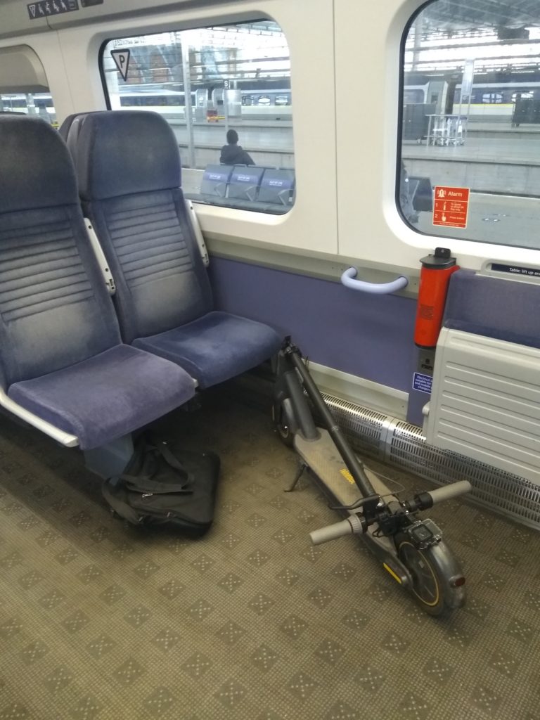 Electric scooter on a train